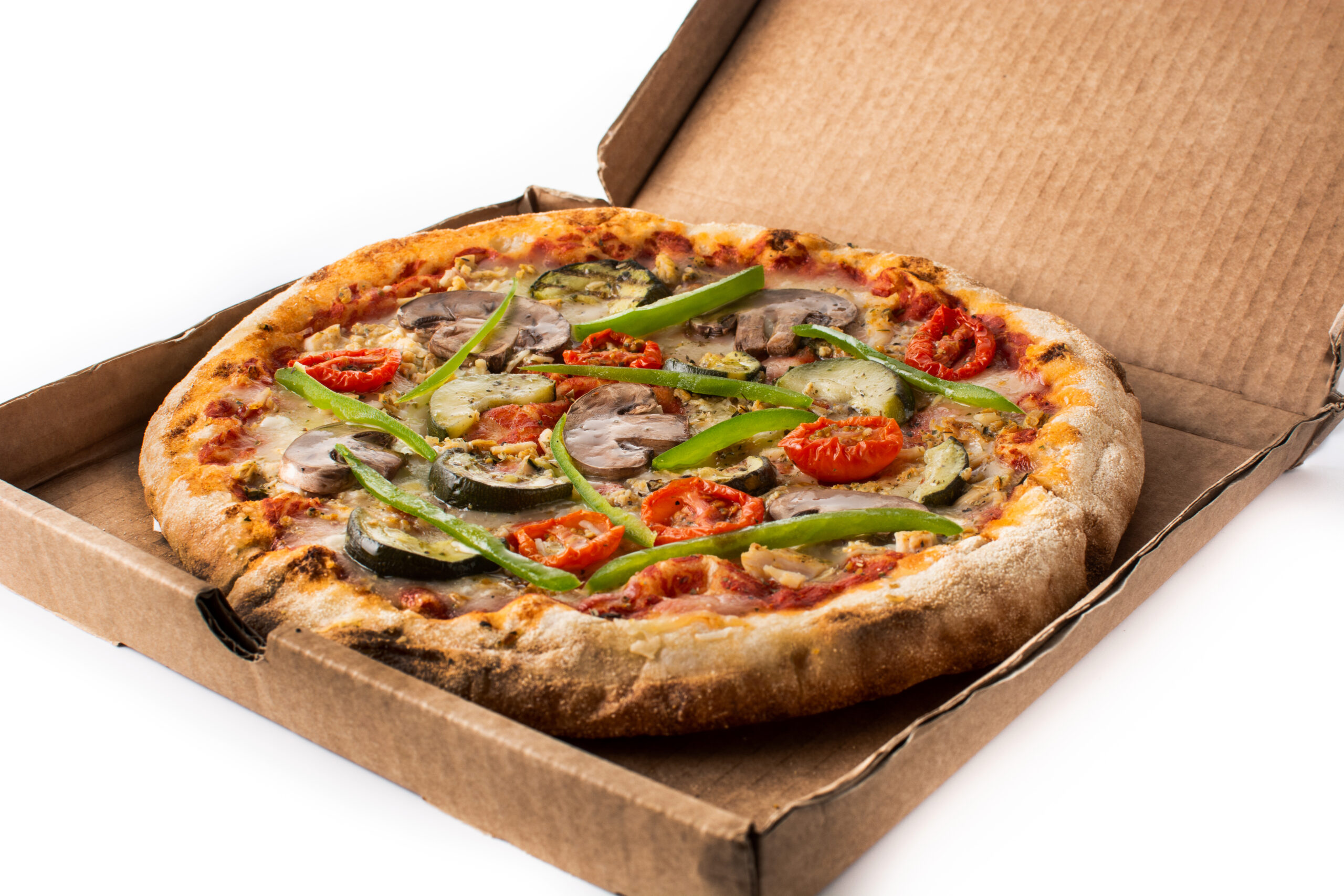 Vegetarian pizza with zucchini, tomato, peppers and mushrooms isolated on white background